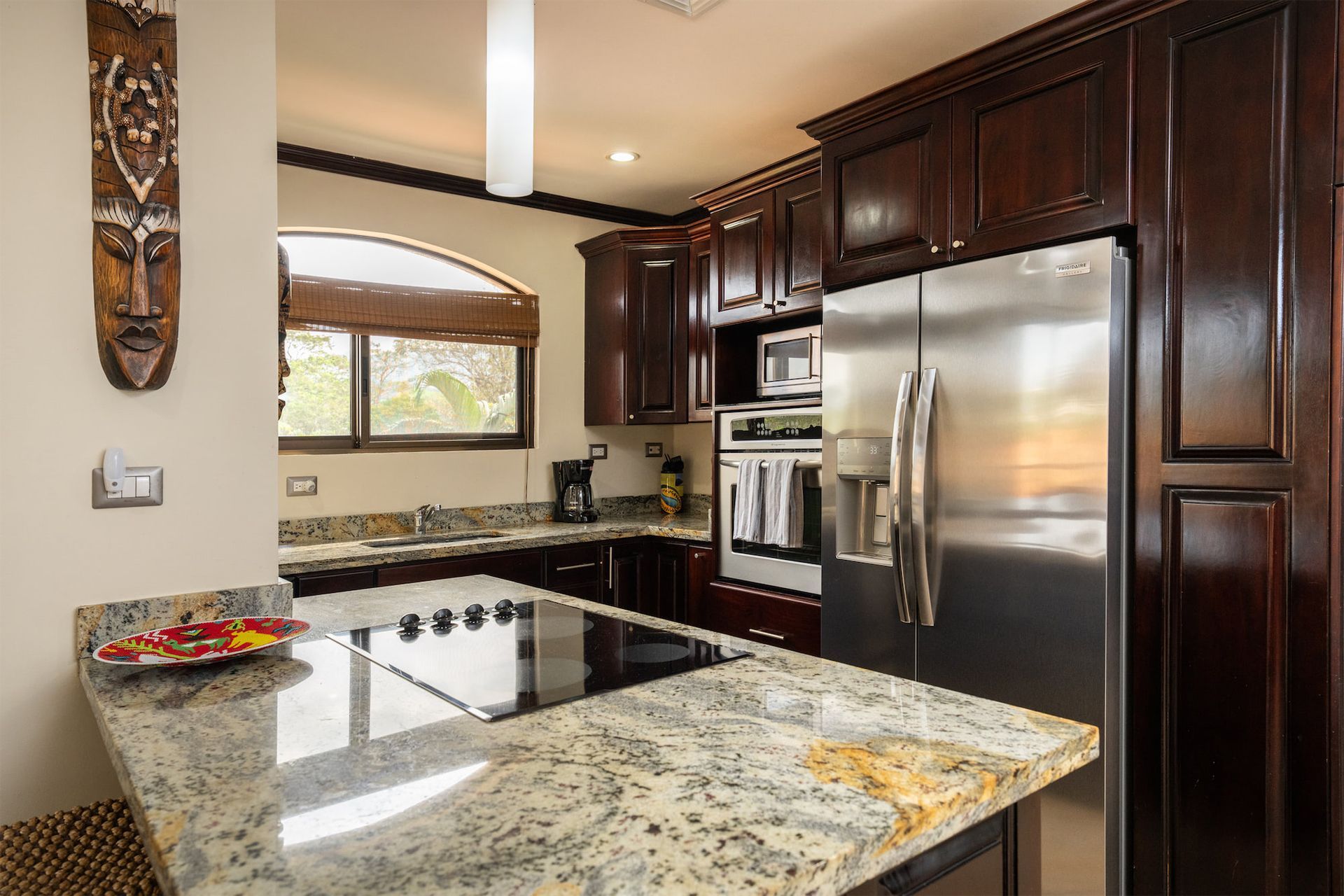 A kitchen with stainless steel appliances and granite counter tops
