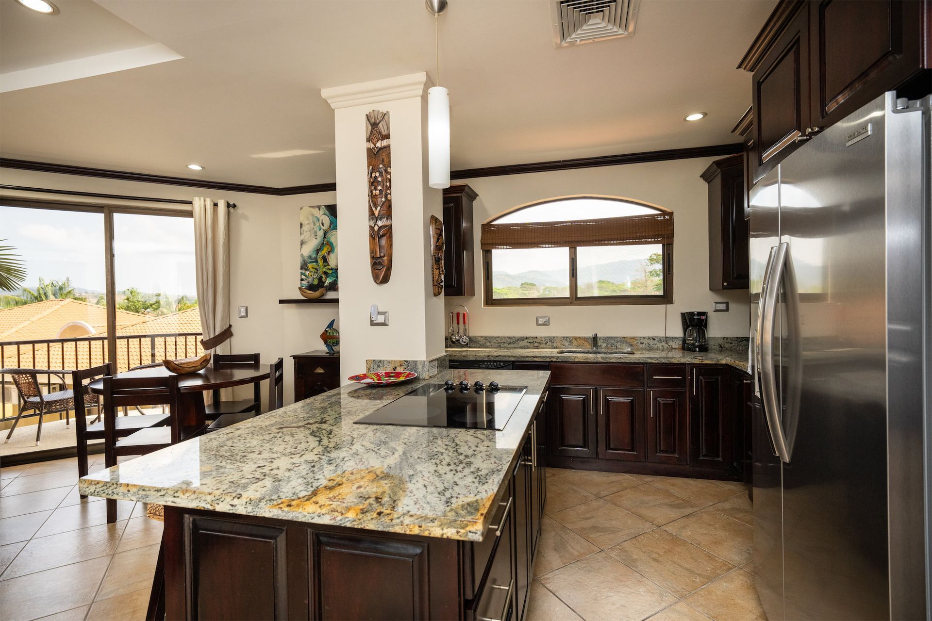 A kitchen with granite counter tops and stainless steel appliances