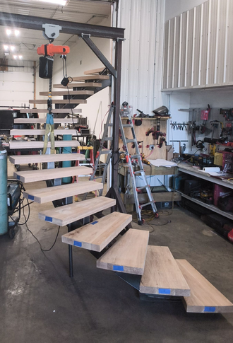 Our crew installing a custom stair railing