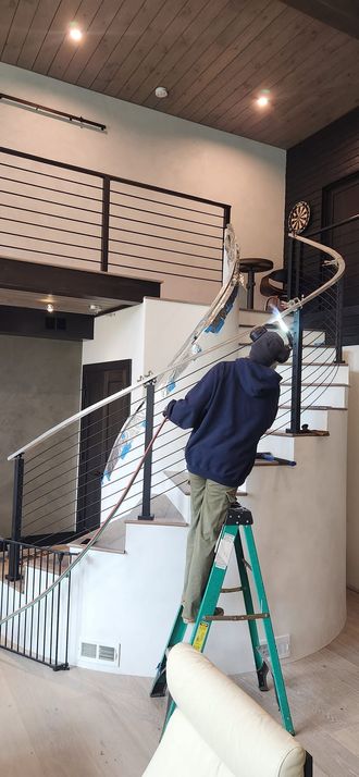 Finished interior stair with custom metal railing