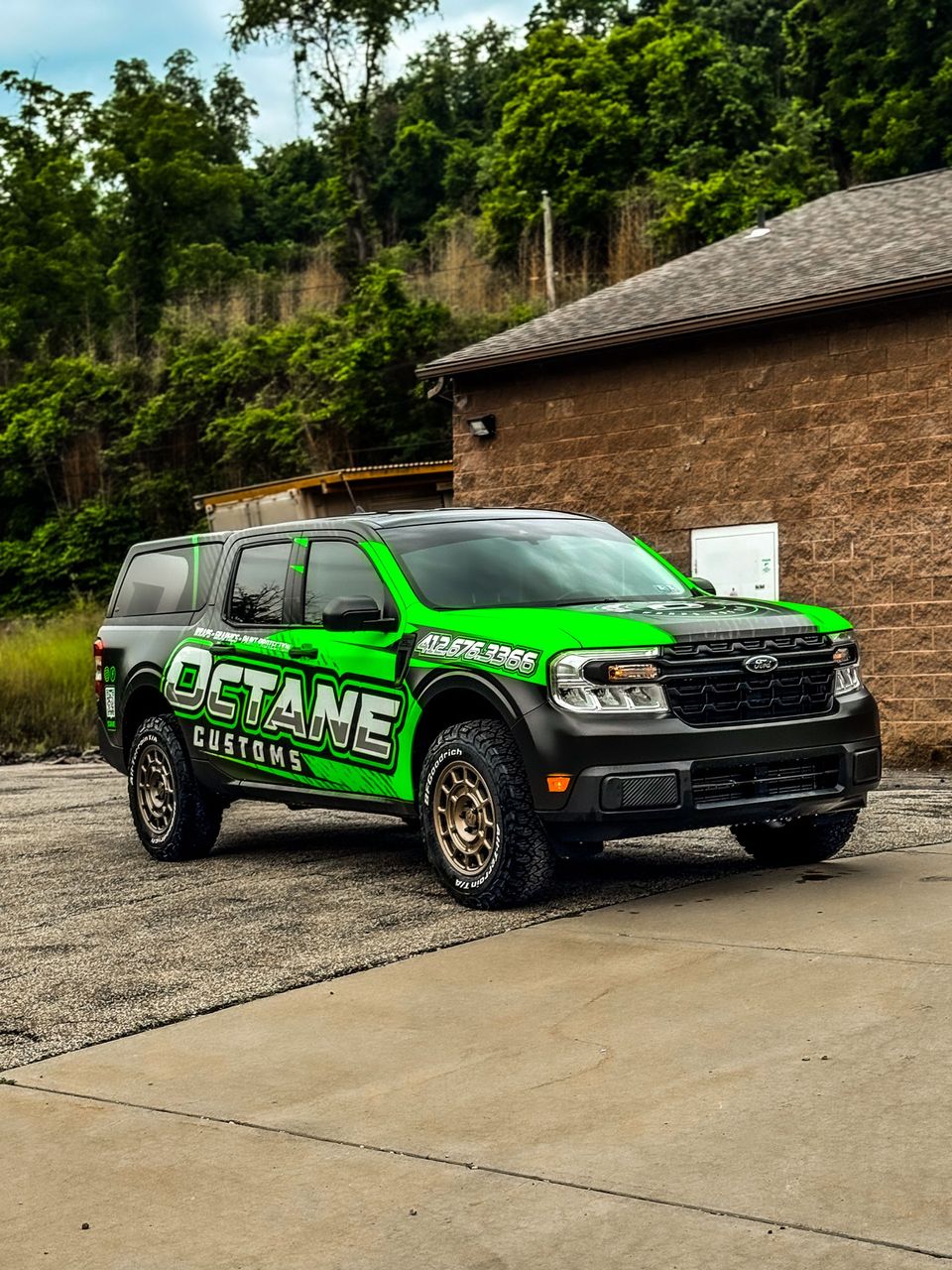 Green and black customized Ford truck with