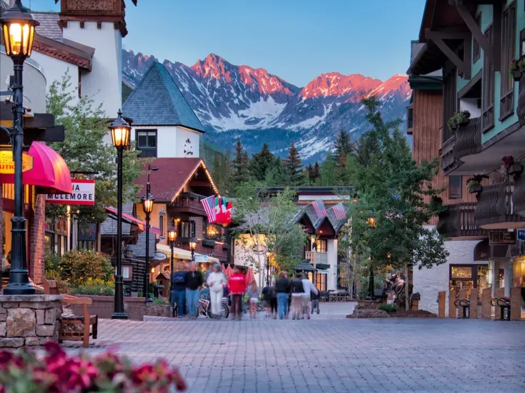 a group of people walking in a town