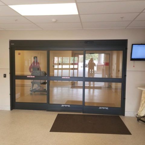Automatic Doors Installation and Repair - A hospital room with a sliding glass door