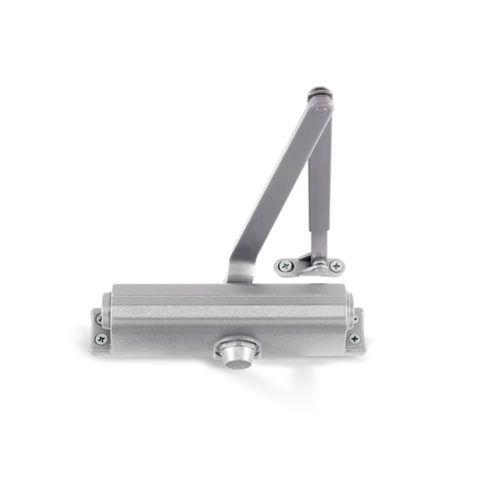 A close up of a door closer on a white background.