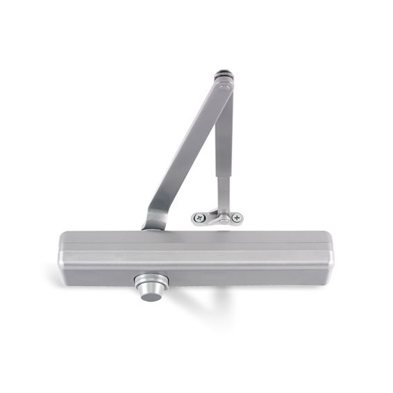 A close up of a door closer on a white background.