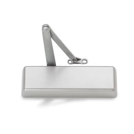 A close up of a door closer on a white background.