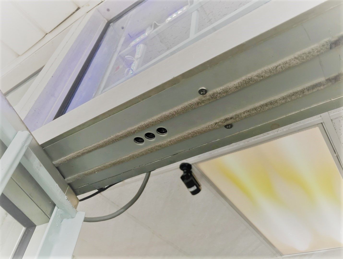 A close up of a metal structure with holes in it