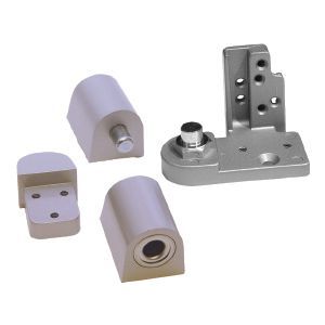 A bunch of metal parts are sitting on top of each other on a white surface.