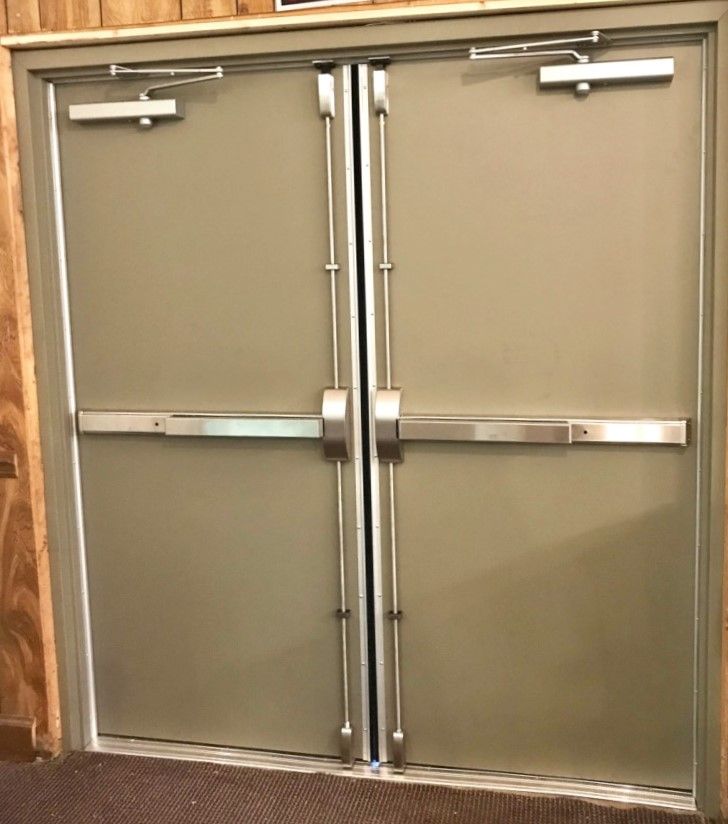 Hollow Metal Doors Installation and Repair - A pair of doors with stainless steel bars on them