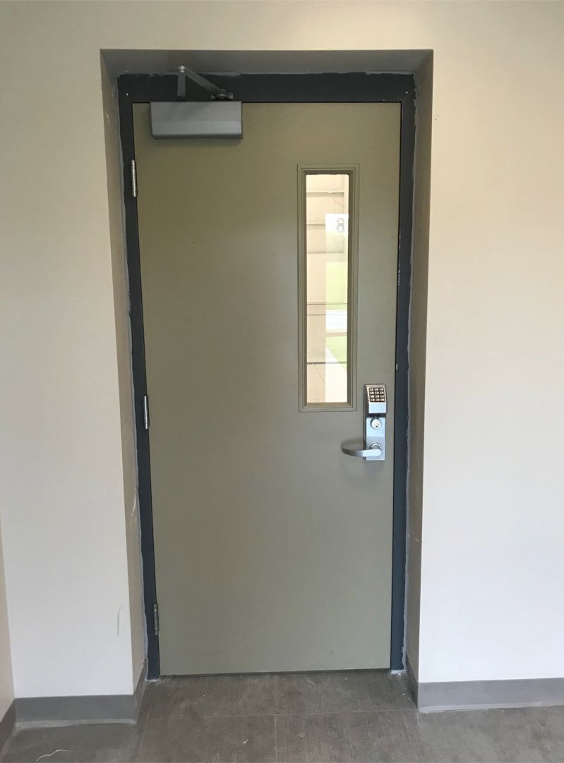 Hollow Metal Doors Installation and Repair - A door with a small window in it