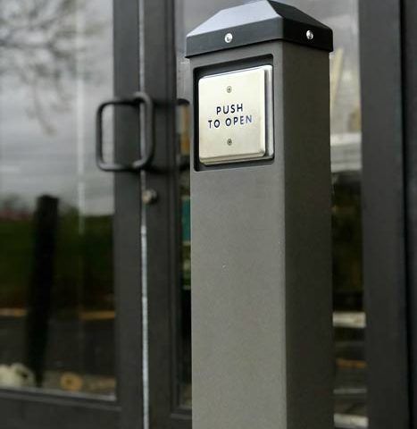 A door with a sign that says push to open