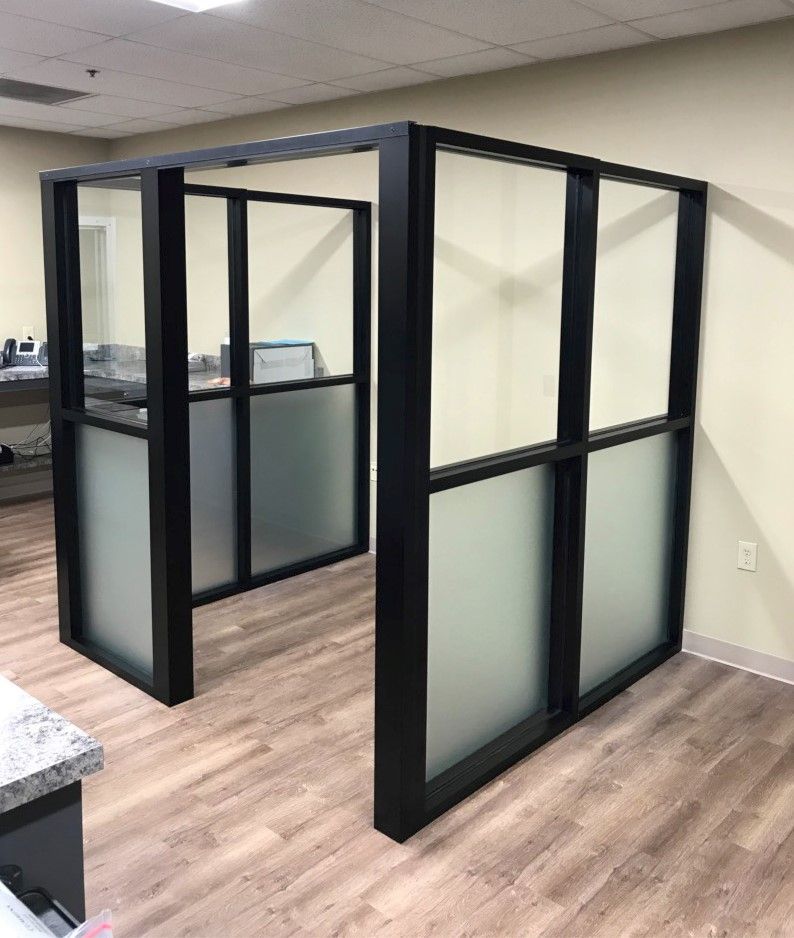 Storefronts & Glass Doors Installation and Repair - A room with a lot of windows and a wooden floor.