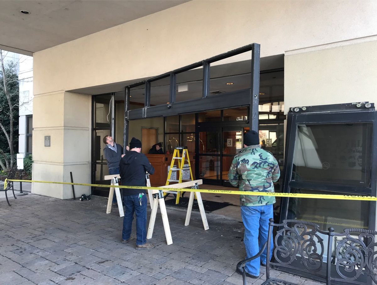 A group of men are working on a building.