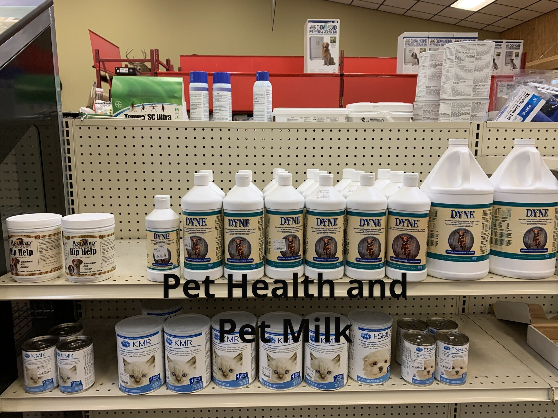 A shelf full of pet health and pet milk products