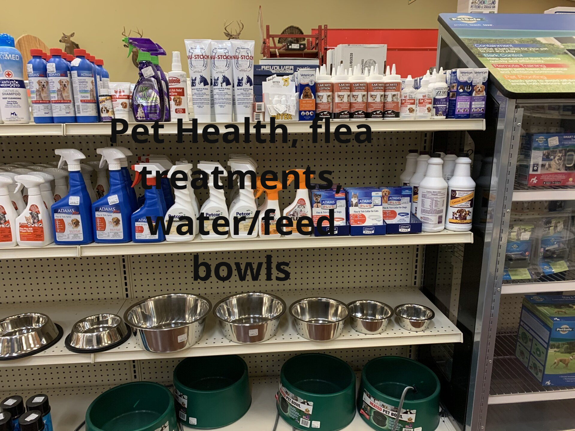 A store shelf filled with pet health products and bowls