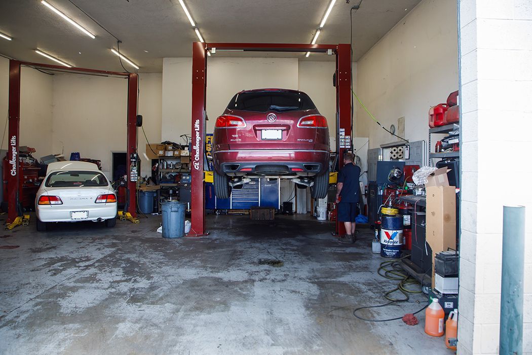 Two vehicles inside of our garage in Centerville, UT | Baker Automotive