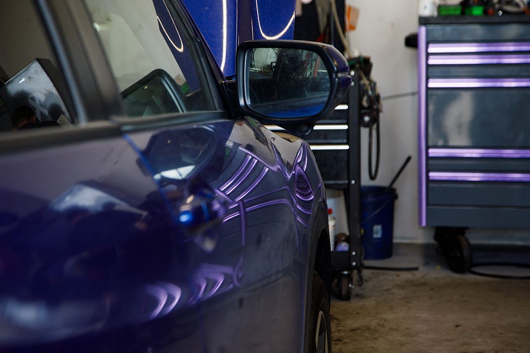 Up close to side of car parked in our auto repair garage in Centerville, UT | Baker Automotive