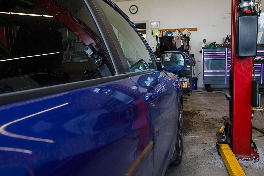 Up close to side of blue car in our garage in Centerville, UT | Baker Automotive