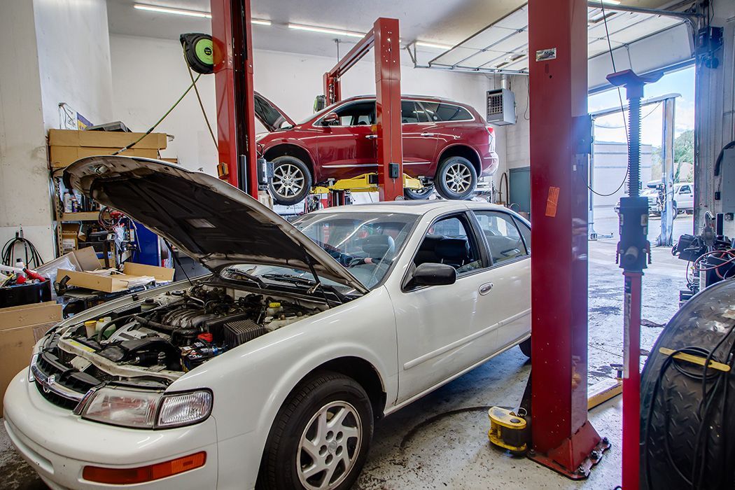 White car with hood up in our garage in Centerville, UT | Baker Automotive