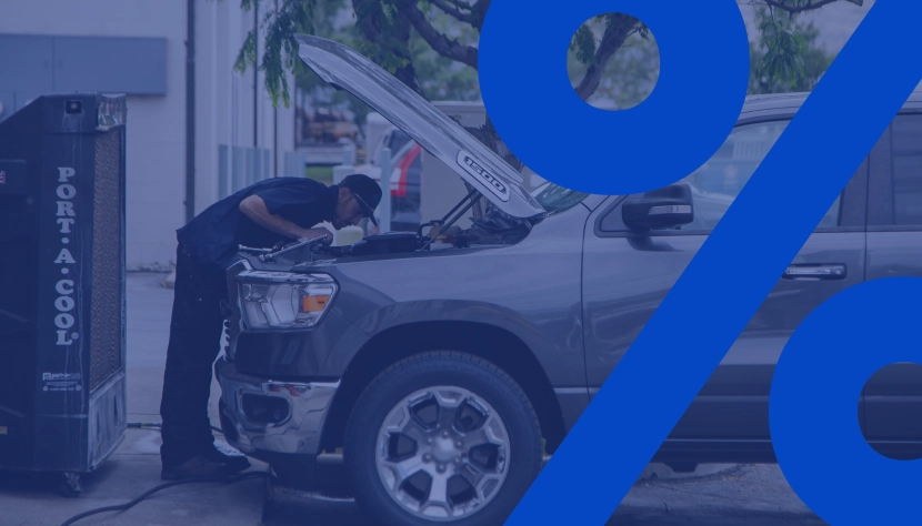 Flexible Financing for the Road Ahead, technician repairing under hood of vehicle outside of shop in Centerville, UT | Baker Automotive