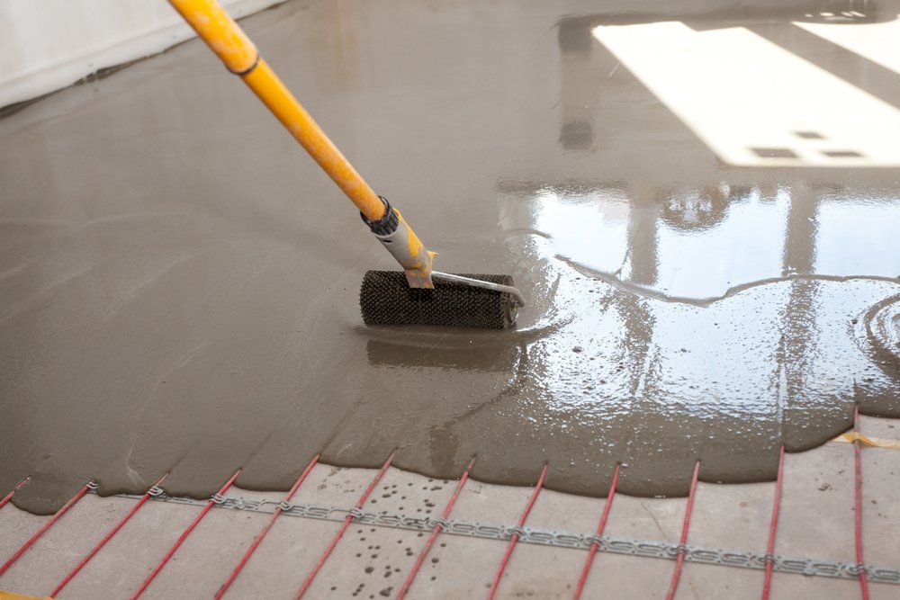 Worker Align Cement With Roller