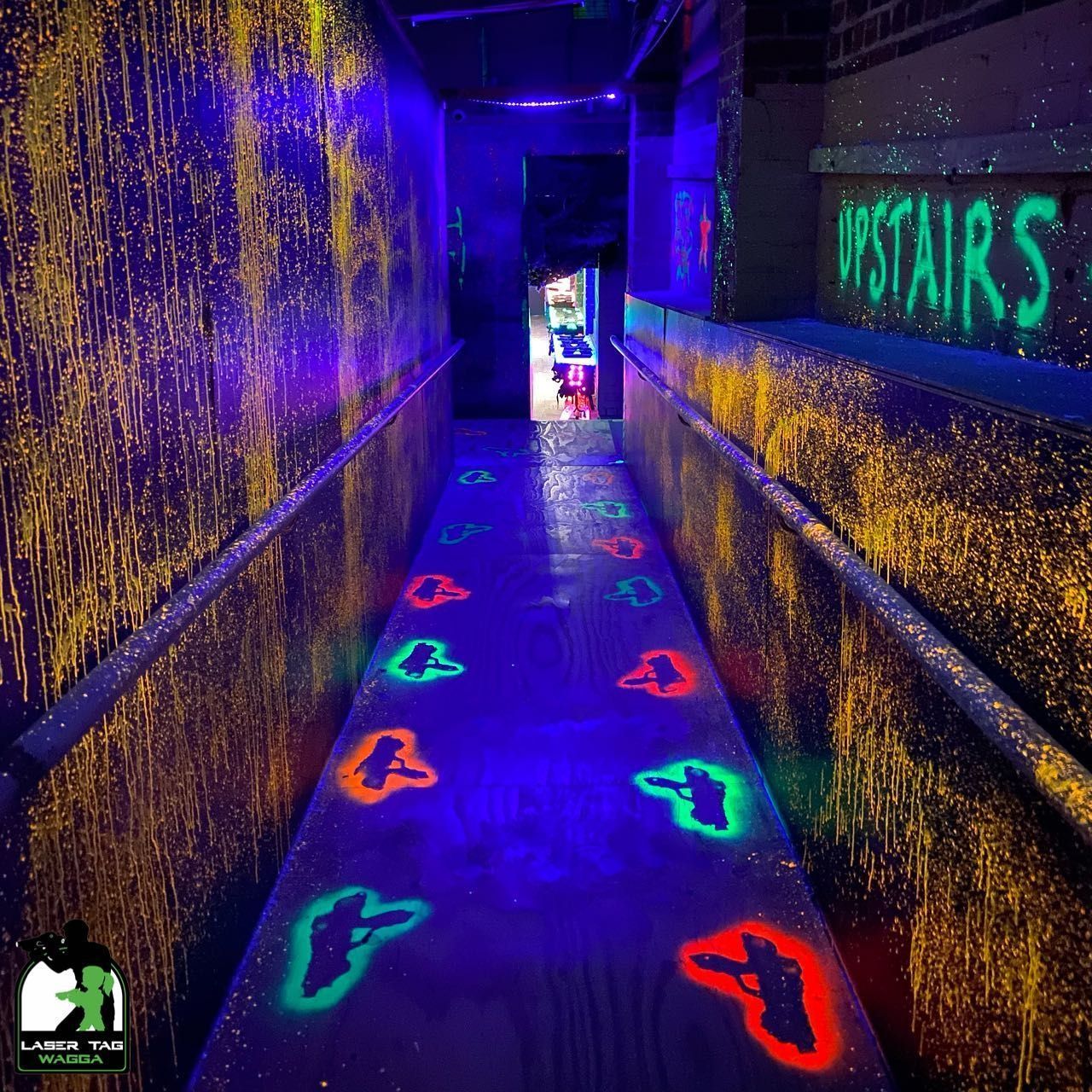 A Hallway With A Carpeted Floor And A Colourful Wall In Laser Tag — Laser Tag Wagga In Wagga Wagga, NSW