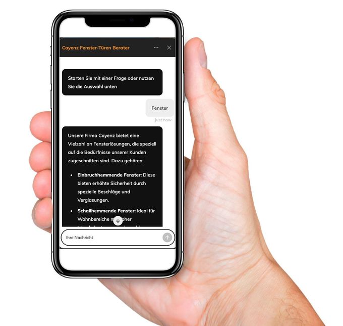 Eine Hand hält ein Smartphone mit dunklem Chat-Bildschirm und weißen Textnachrichten.