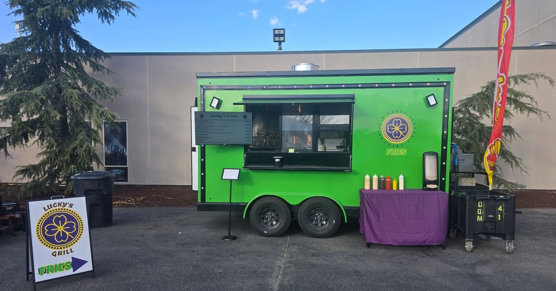 Lucky's Grill green food trailer parked and ready to serve