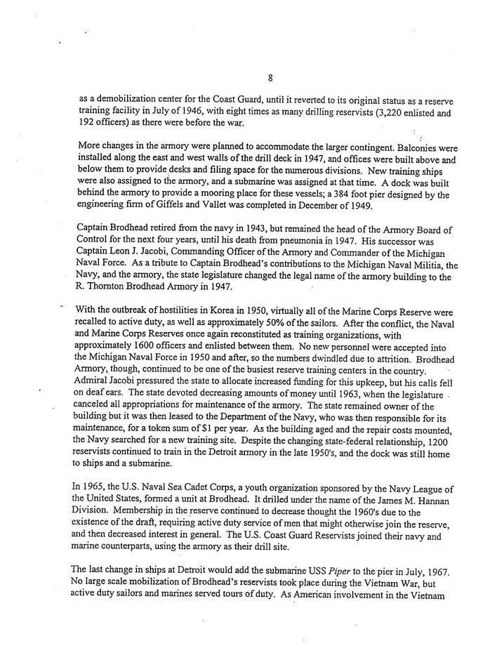 Blurry white page filled with dense black text, like a document or article.