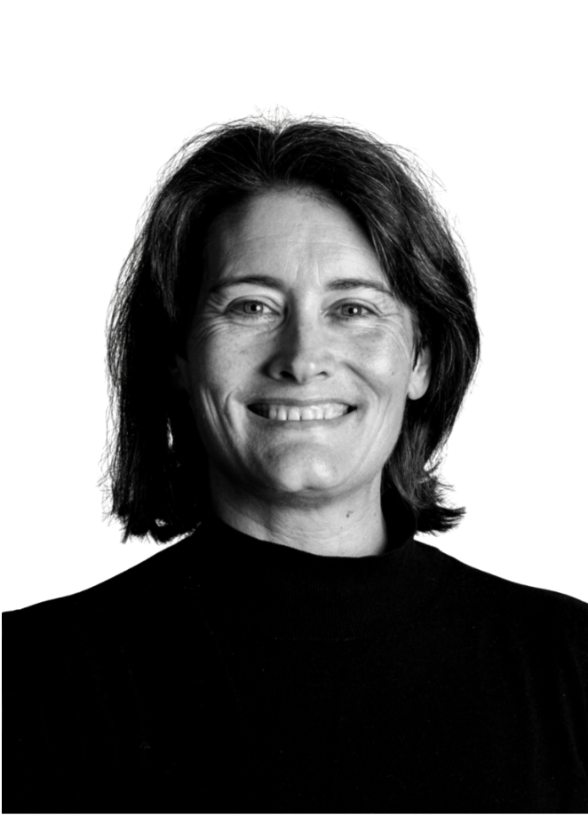 A black-and-white headshot of a smiling person with dark hair against a plain white background.