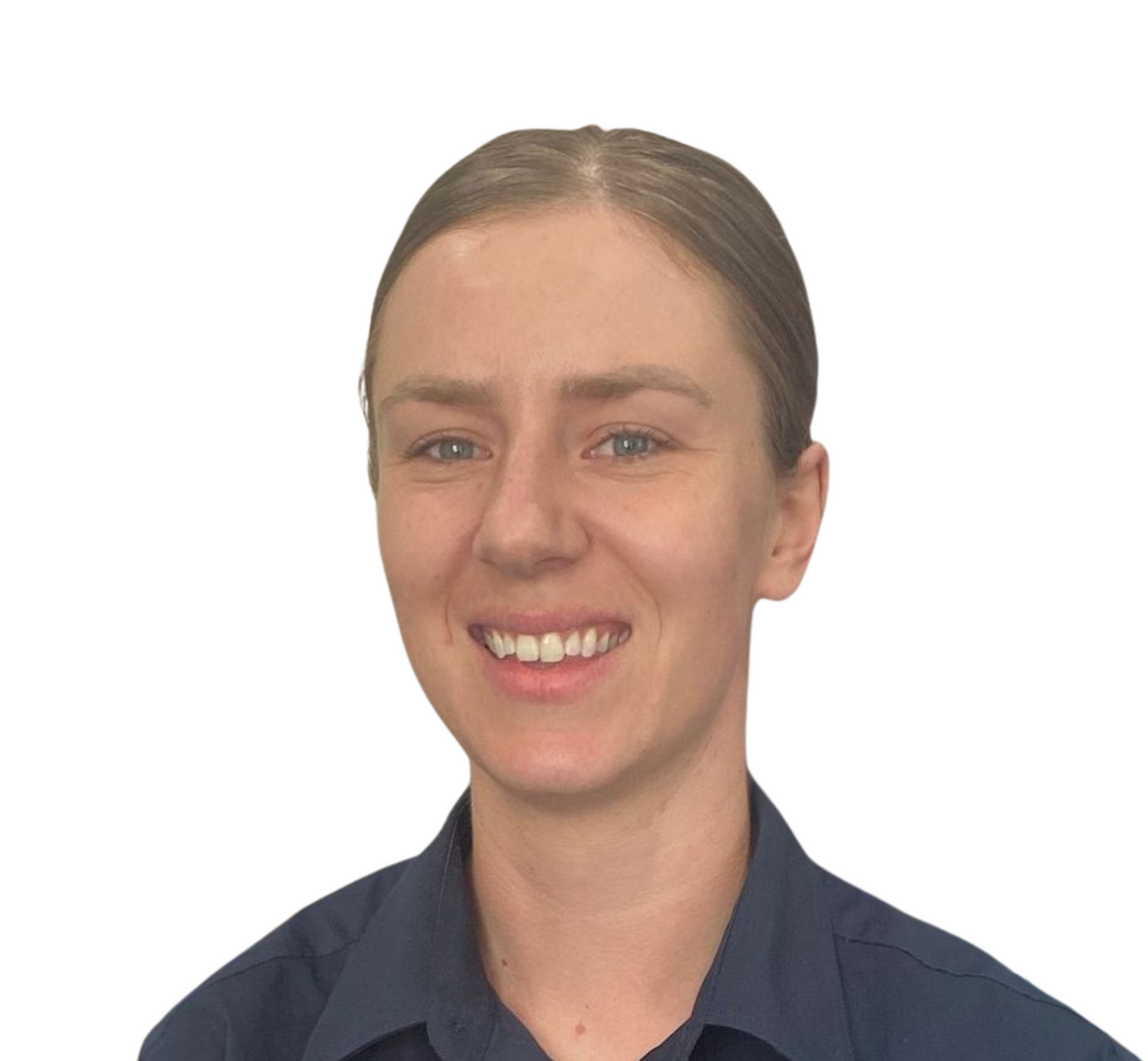 A smiling person with light brown hair pulled back, wearing a navy blue collared shirt against a white background.