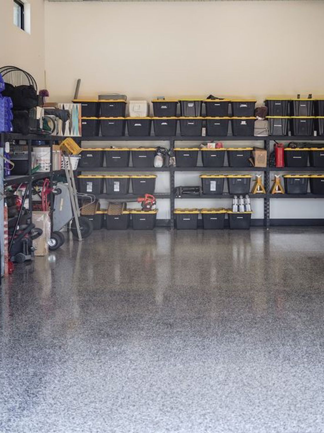 A garage filled with lots of shelves and bins.