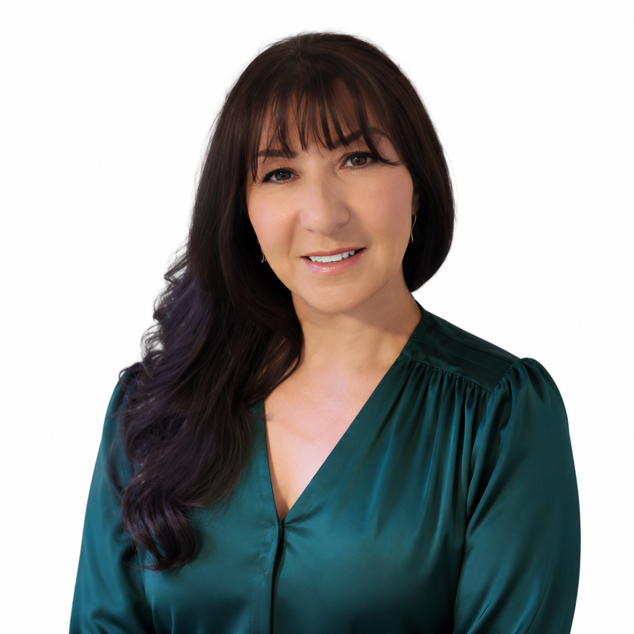 Portrait of a woman in a dark green blouse against a white background
