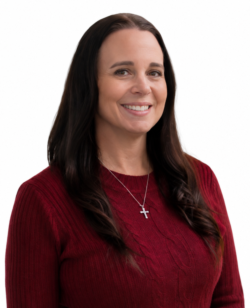 Smiling woman with long dark hair wearing a red sweater and silver cross necklace on a white background