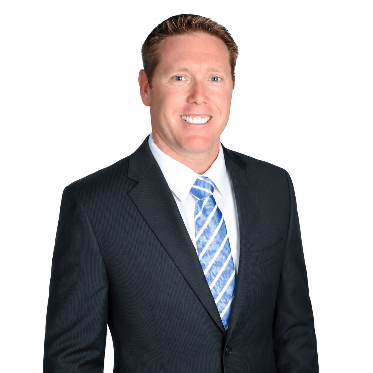 Professional headshot of a smiling person in a dark suit with a blue striped tie on a white background