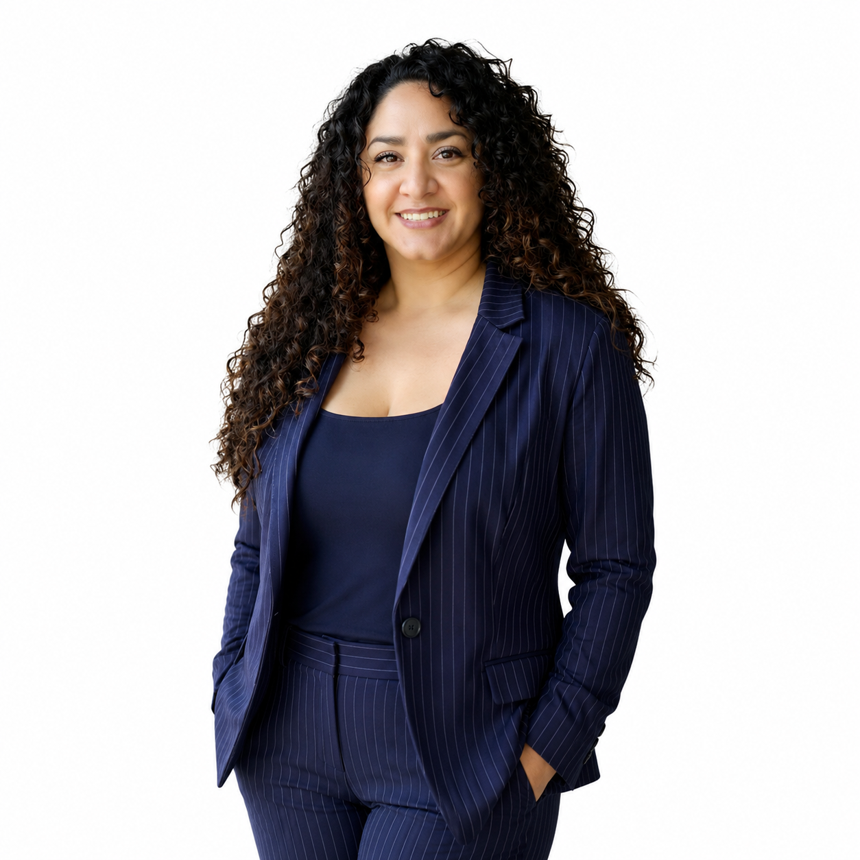 Smiling woman in a navy pinstripe suit standing against a white background