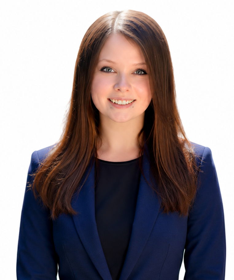 Smiling woman in a navy blazer against a white background