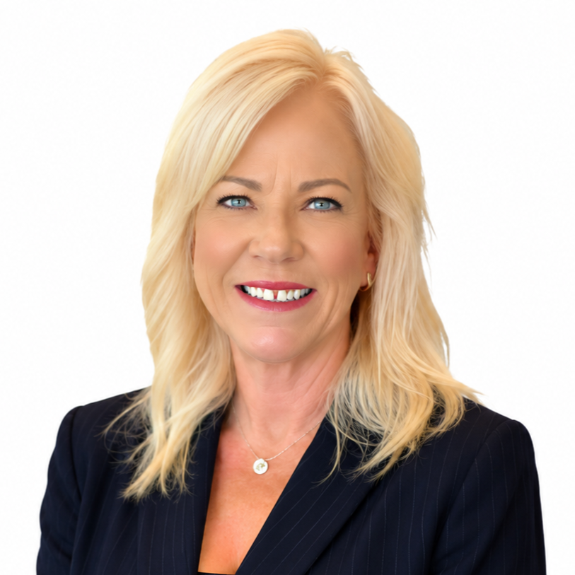 Portrait of a smiling blonde woman in a black blazer against a white background
