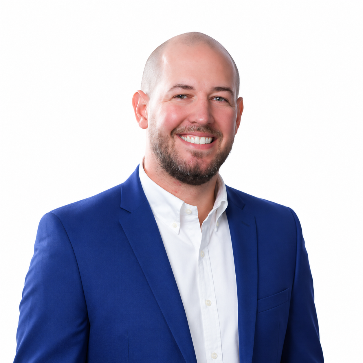 Smiling bald man in a blue suit jacket and white shirt on a white background