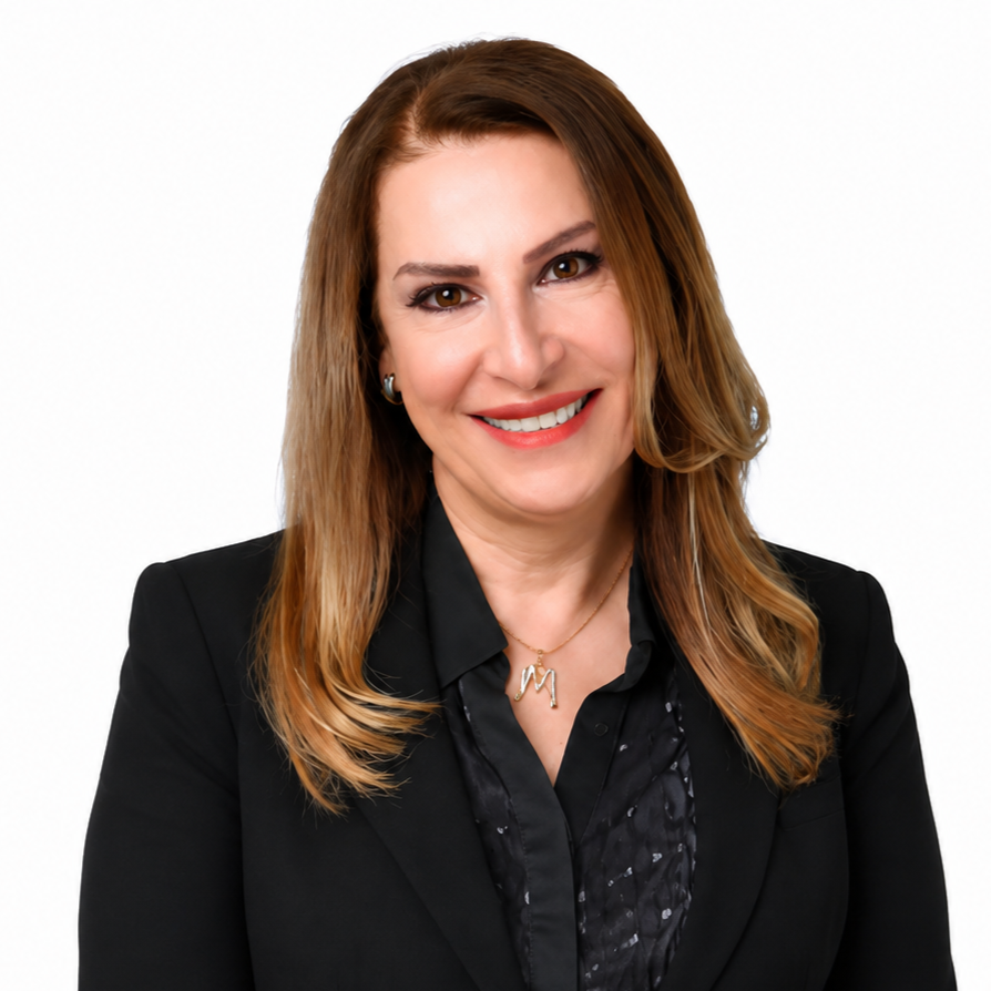 Portrait of a smiling woman in a black blazer against a white background