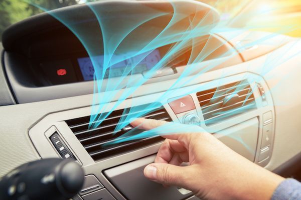 Hand adjusting car air vent with blue air flow visualization. | Rocky Mountain Car Care