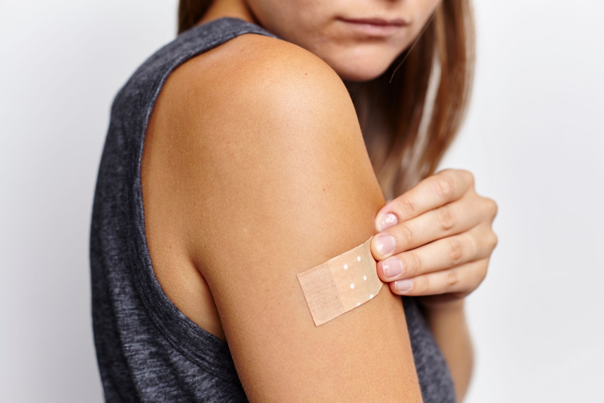 Woman with bandage on arm