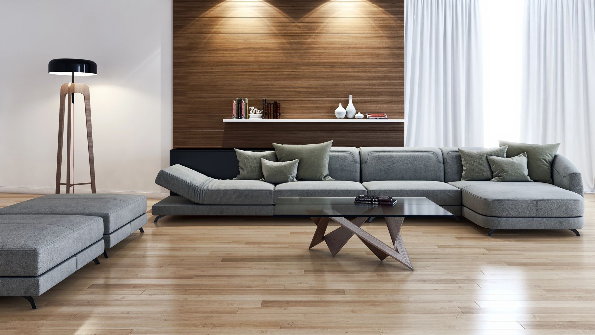 Soggiorno moderno con un grande divano componibile grigio, un pouf, una parete decorativa in legno e una lampada da terra.