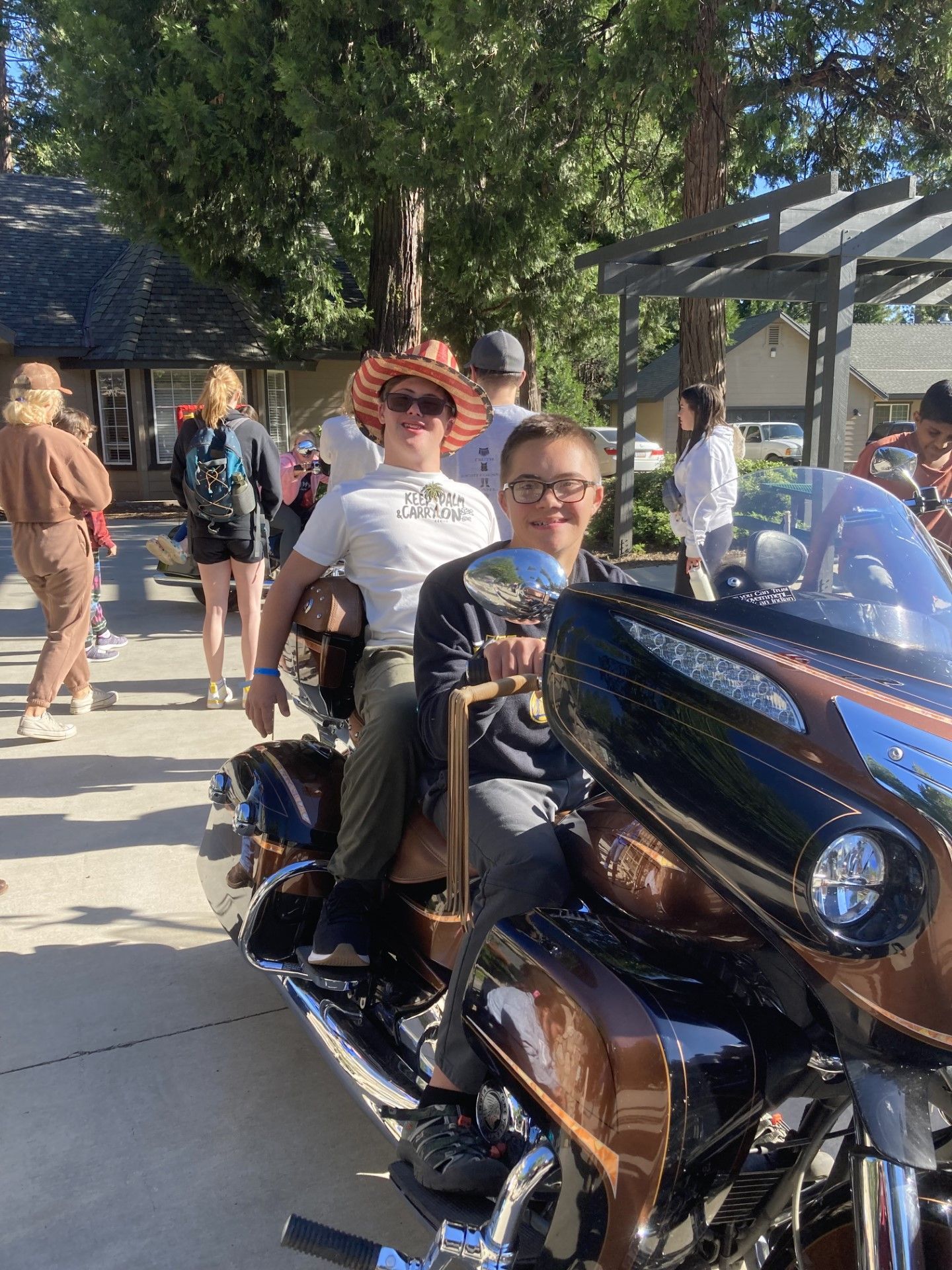 A man and a woman are sitting on a motorcycle.