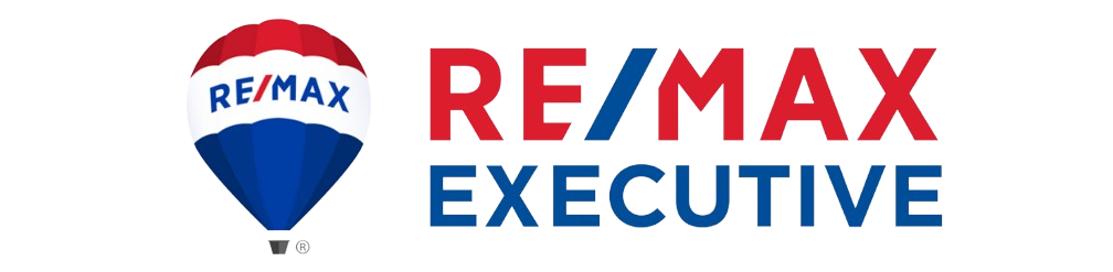 A re / max executive logo with a hot air balloon in the middle