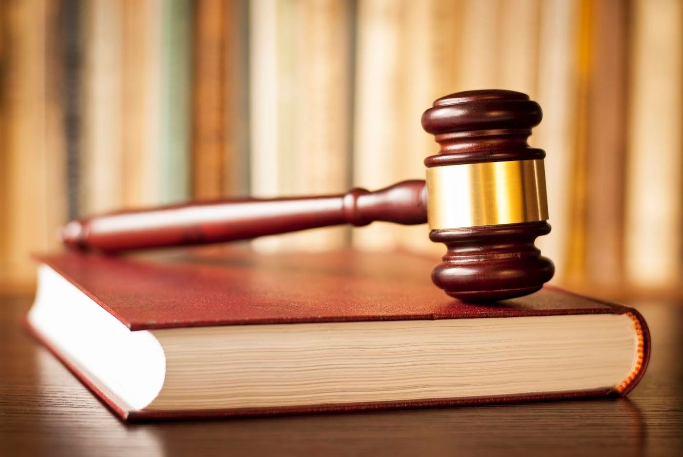 A law book and gavel highlighting legal aspects of moving services and Hudson River Moving & Storage's compliance with regulations.