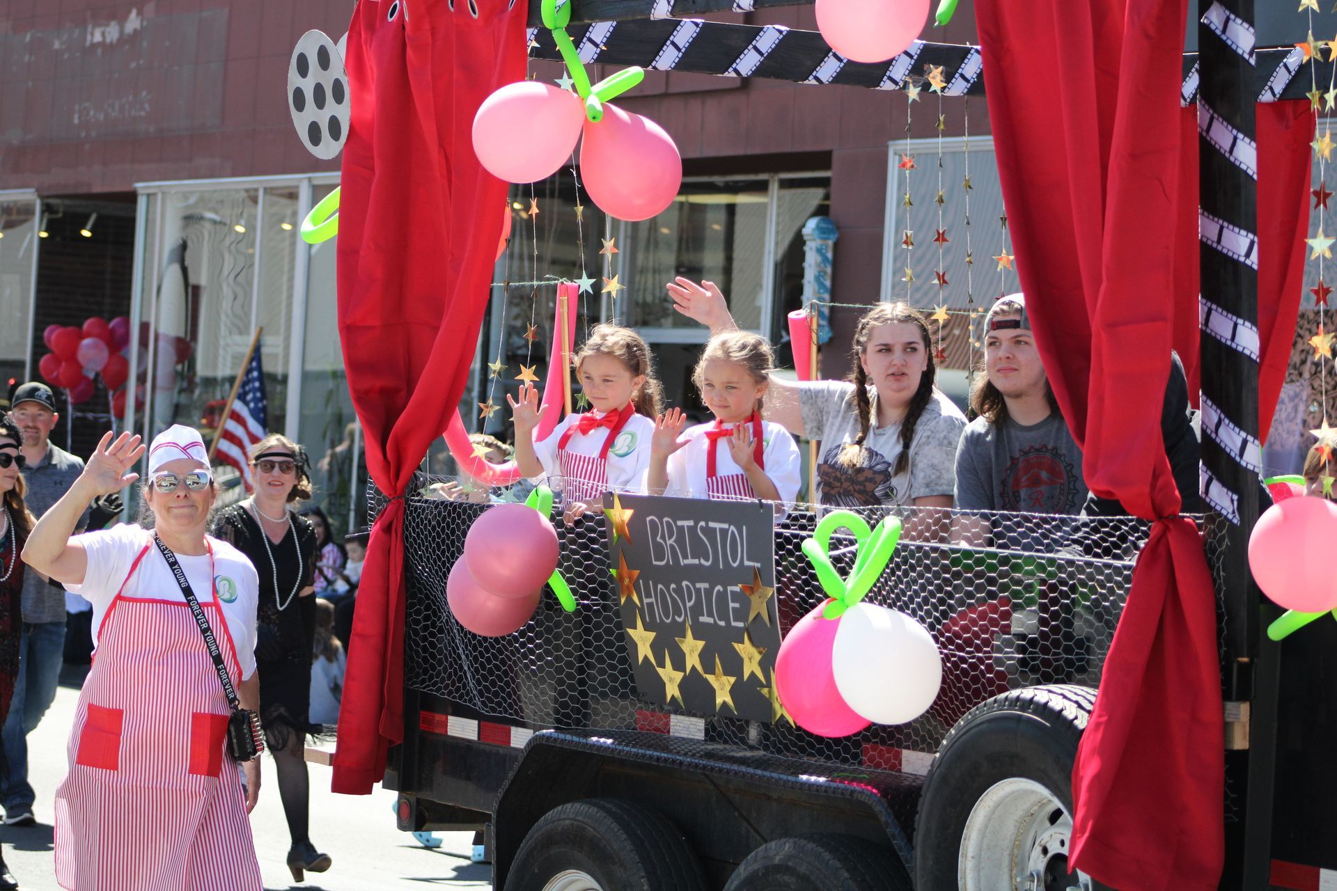 A parade with a float that says crystal justice