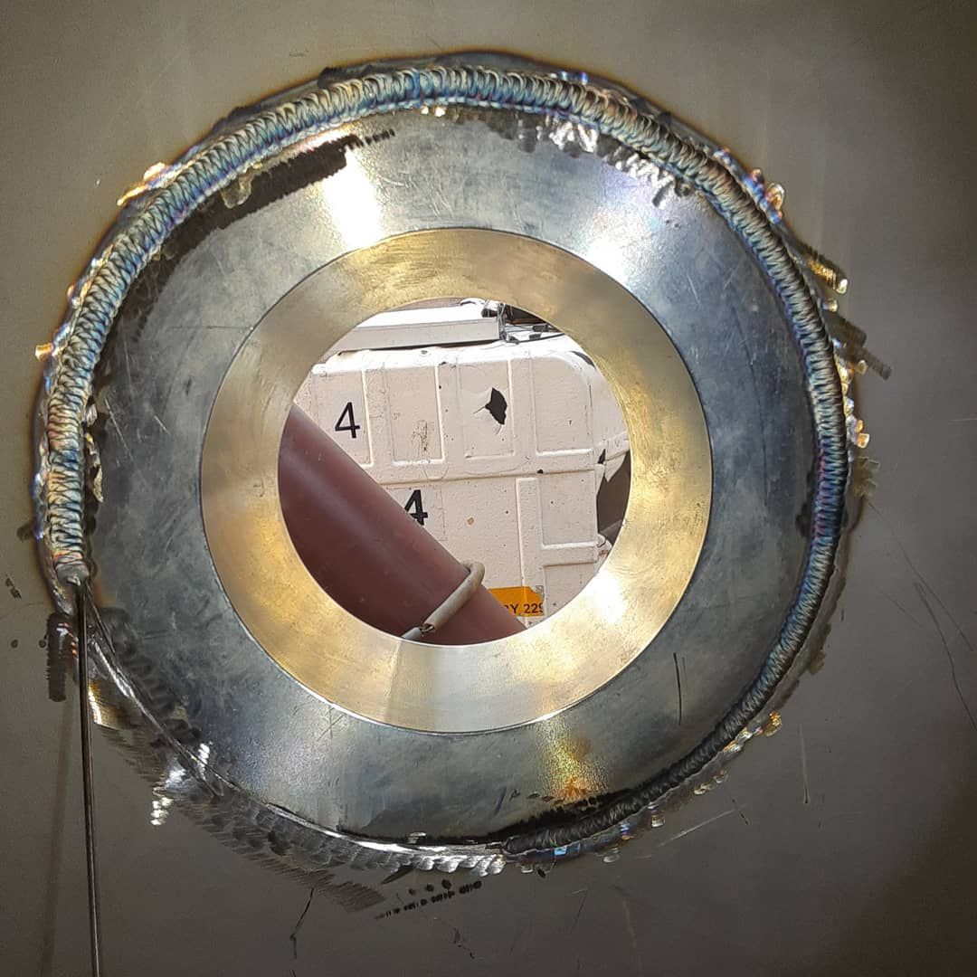 A metal ring with a hole in the middle of it