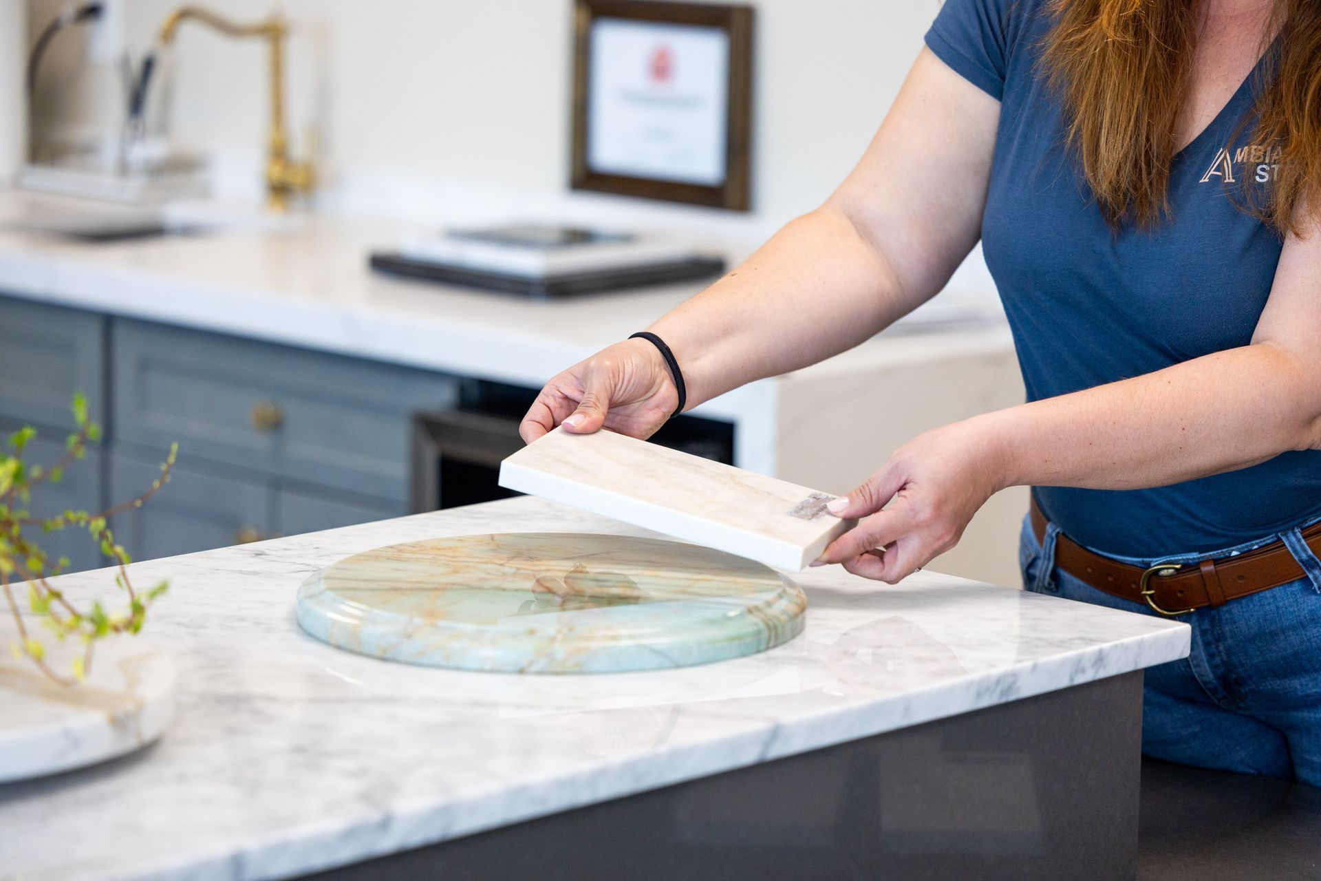 Person examining stone countertop samples