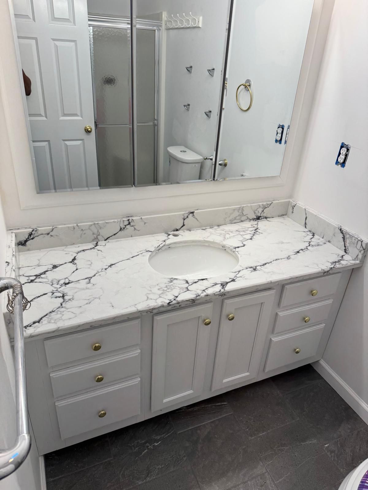 A custom stone bathroom vanity countertop installed by Ambiance Stone.